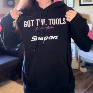 Size small, black and pink snap on hoodie.